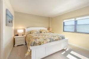 Postel nebo postele na pokoji v ubytování The Islander - 5E by Sea Scape Properties