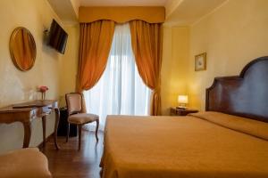 Voodi või voodid majutusasutuse Hotel Rigel toas