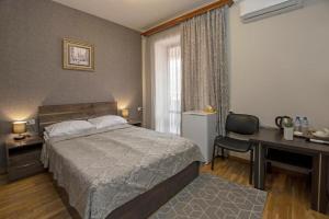 Voodi või voodid majutusasutuse Hotel Season toas