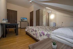 Voodi või voodid majutusasutuse Hotel Season toas