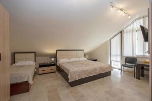 Voodi või voodid majutusasutuse Hotel Season toas