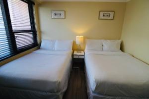 Krevet ili kreveti u jedinici u okviru objekta Alexander 511 Beachfront condo with 2 pools, direct beach access, sauna, tikki bar