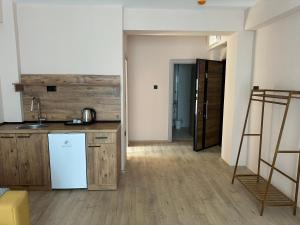 a kitchen with a sink and a refrigerator at NIKA The architect DIAMOND OF GEVGELIA in Gevgelija