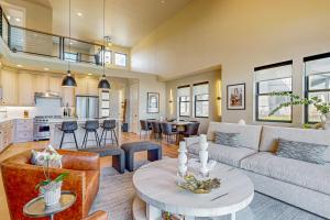 a living room with a couch and a table at Lakeside Luxury in Heber City