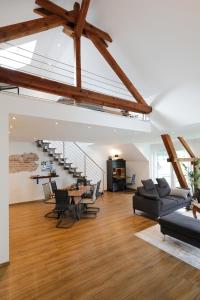 a large living room with a table and chairs at Ferienloft Lippe in Lage