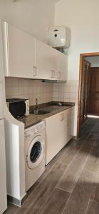 A kitchen or kitchenette at Marlenghi Apartments 70