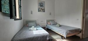 Posteľ alebo postele v izbe v ubytovaní Marlenghi Apartments 70 + 32 fotografií