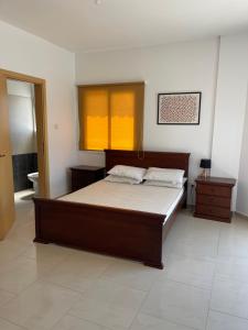 a bedroom with a large bed in a room at Valentine Family Villa in Kiti