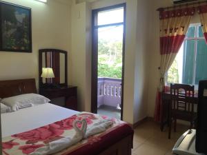 Giường trong phòng chung tại Star Binh Duong Hotel
