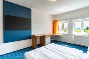 TV a/nebo společenská místnost v ubytování City Inn Hotel Olomouc