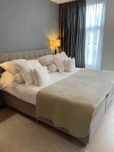 Ένα ή περισσότερα κρεβάτια σε δωμάτιο στο 115 m2 apartment with garden 200m from the beach