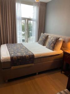 Ένα ή περισσότερα κρεβάτια σε δωμάτιο στο 115 m2 apartment with garden 200m from the beach