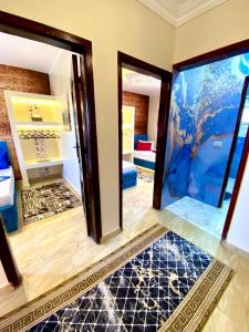 a room with two doors and a room with an aquarium at Horus pyramids view in Cairo