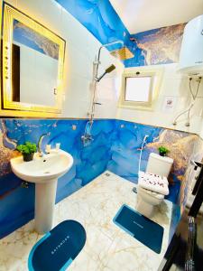 a bathroom with a toilet and a sink at Horus pyramids view in Cairo +52 photos
