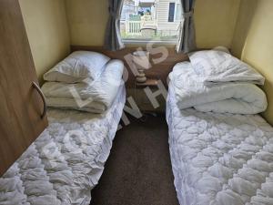 Ένα ή περισσότερα κρεβάτια σε δωμάτιο στο Caravan Meg