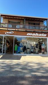 a store front of a store with a large window at Residencial Angelina in Praia do Forte