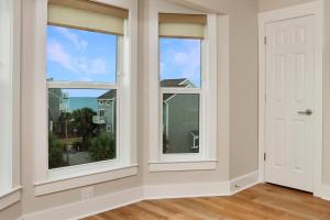 a room with two windows and a door at Sea Cliff K-68 Aqua La Vista Baby! by Pristine Properties Vacation Rentals in Oak Grove +29 photos