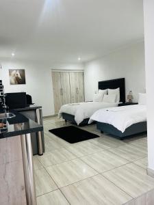 Ένα ή περισσότερα κρεβάτια σε δωμάτιο στο Zindiza Guesthouse 2