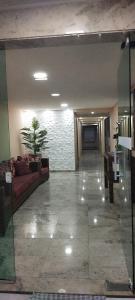 a living room with a couch and a fireplace at Apê Temporada II Praia Grande SP Completo com Piscina, Churrasqueira, Estacionamento in Praia Grande +22 photos