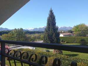 a view of the mountains from the balcony of a house at B&B L'Ortensia in Vignolo