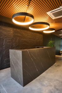 a lobby with a counter with lights on it at HYPE STATES Cali in Cali