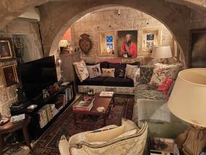 a living room with a couch and a table at No 7 Casa Nannakola in Naxxar