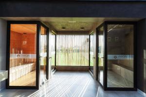 a hallway with sliding glass doors in a building at Awqa Loft & Camp in Trujillo +43 photos