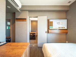 Postel nebo postele na pokoji v ubytování Super Hotel Nagoya Shinkansenguchi + 37 fotografií