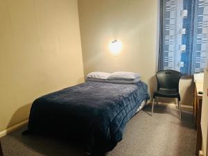 Postel nebo postele na pokoji v ubytování Merrylees Hotel