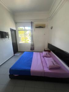 Voodi või voodid majutusasutuse Dung Fang Hotel toas
