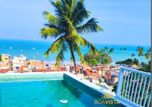 a view of the ocean from the balcony of a resort at Pousada Boa Vista in Maragogi