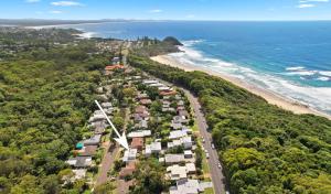 an aerial view of a beach with houses and the ocean at Azul Blue at Shellys in Port Macquarie