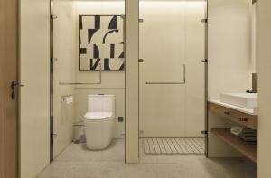 a bathroom with a toilet and a sink at Holiday Inn Express Xi'an Daxing by IHG in Xi'an