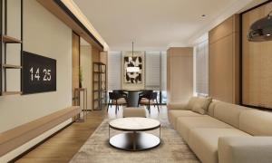 a living room with a couch and a table at Holiday Inn Express Xi'an Daxing by IHG in Xi'an