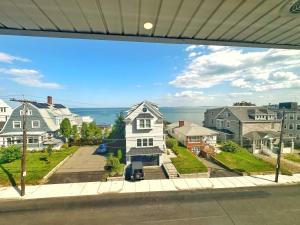 a view through a window of a house at Winthrop Arms Hotel Restaurant Logan Airport in Winthrop