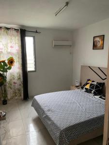 Ένα ή περισσότερα κρεβάτια σε δωμάτιο στο Les Résidences belle vue