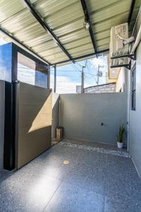 an inside view of a building with a room with a wall at Industrial Themed House in General Santos City in General Santos +8 photos