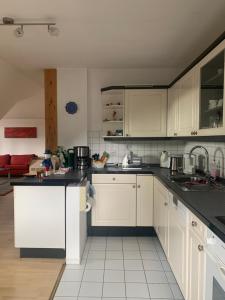 Kuchyň nebo kuchyňský kout v ubytování Kleines Dachzimmer mit Balkon + 5 fotografií