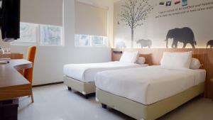 Letto o letti in una camera di Front One Resort Magelang