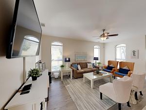 a living room with a couch and a table at Changes In Latitude in Destin