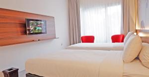 Letto o letti in una camera di Front One Resort Magelang