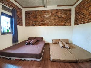 Postel nebo postele na pokoji v ubytování Omah Trasan Pangrango