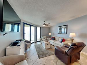 a living room with a couch and a table at Phoenix III #3146 in Orange Beach