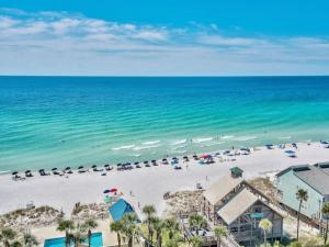 an aerial view of a beach with umbrellas and the ocean at Changes In Latitude in Destin