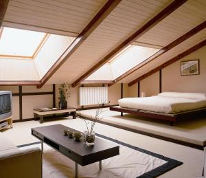 a bedroom with a bed and skylights at El Milano Real in Hoyos del Espino