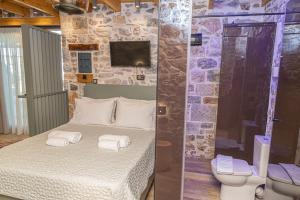 Stefanis Guest House II客房内的一张或多张床位