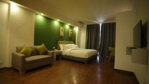 Ένα ή περισσότερα κρεβάτια σε δωμάτιο στο Manara Riva Suites