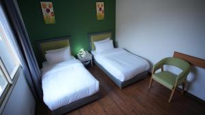 Ένα ή περισσότερα κρεβάτια σε δωμάτιο στο Manara Riva Suites