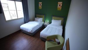 Ένα ή περισσότερα κρεβάτια σε δωμάτιο στο Manara Riva Suites