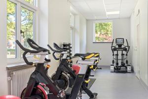 two bikes parked in a room with a gym at Best Western Valhall Park Hotell in Ängelholm